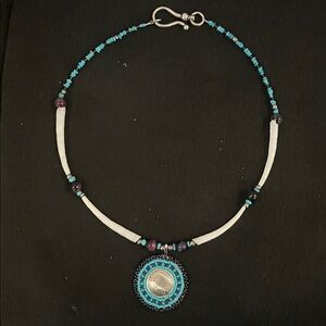 Elegant Beaded Necklace with Silver Pendant